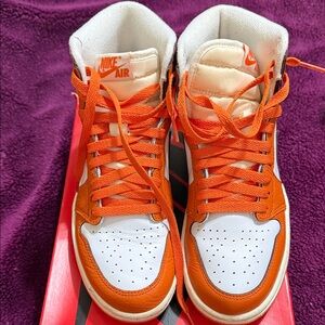 Women Nike Air Jordan 1 Retro High-Top Sneakers in Orange and White